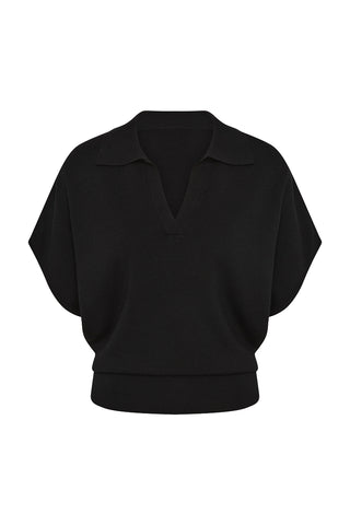 A loose fitting short-sleeve top with a collar on a white background.