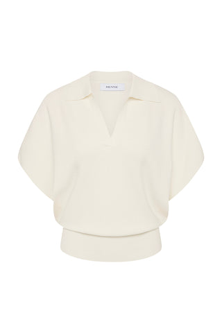 A white loose-fitting short-sleeve collared top on a white background.